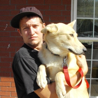 Justin with adopted dog